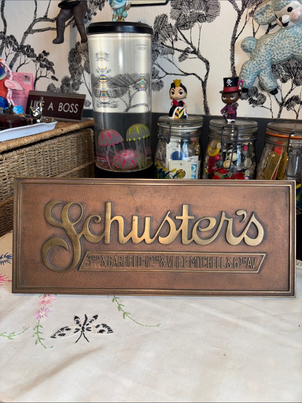 EUC VINTAGE Schuster's Department Store metal plaque with stand. The rear stamp